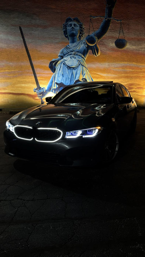 BCSC Build 001 — @g20ev's BMW 330i xDrive at the mural at night