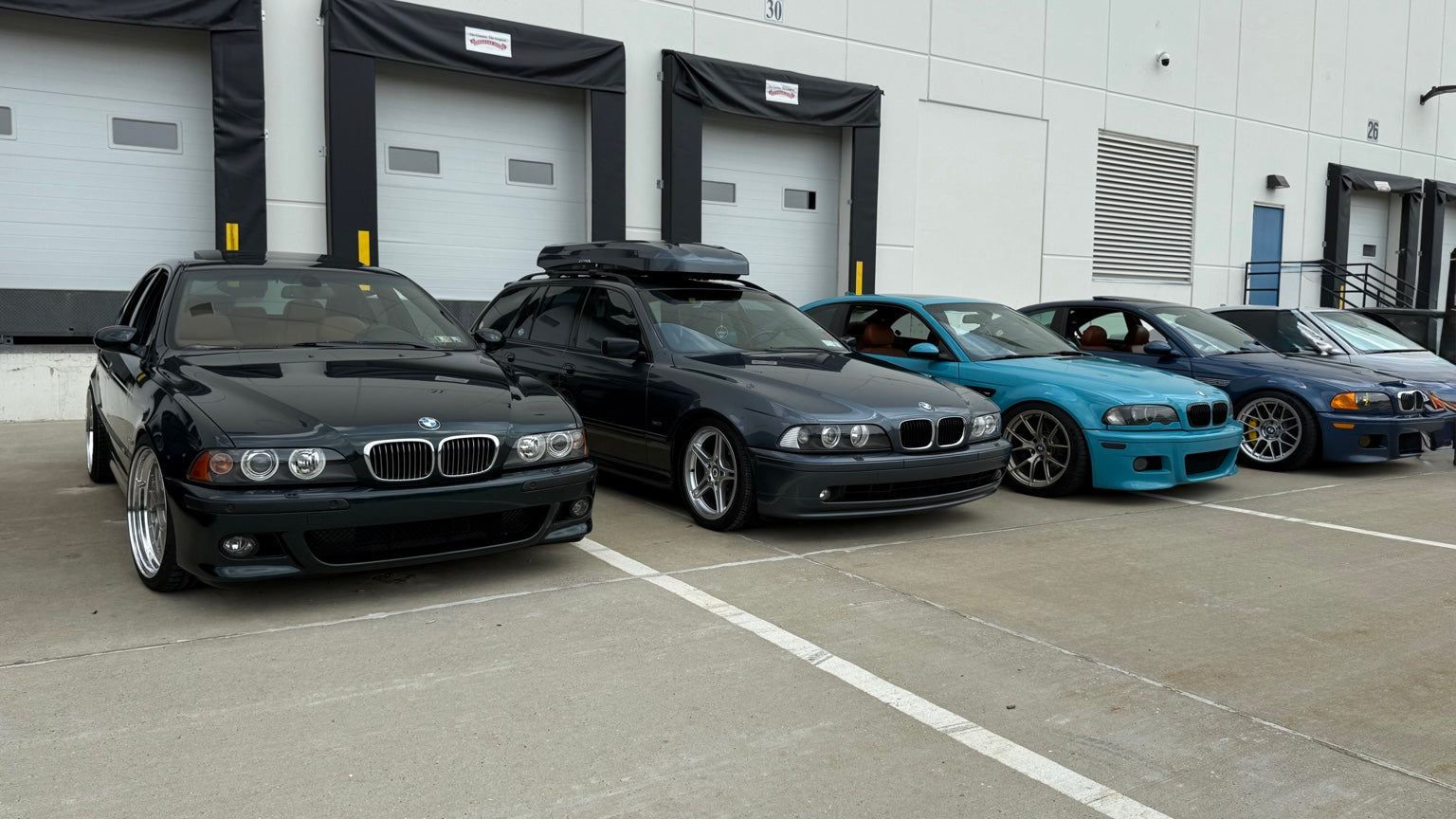 Modified BMW lineup at a car meet - Bad Company Supply Co automotive culture